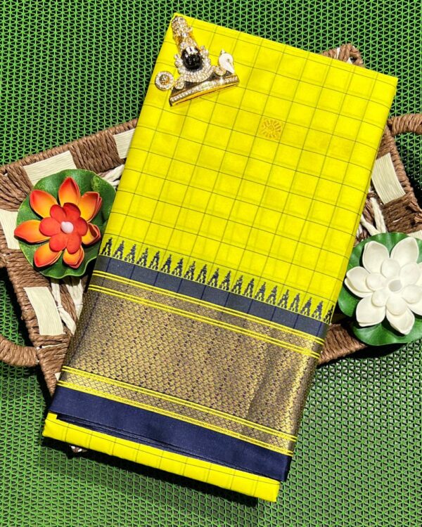 A luxurious Kanjivaram silk saree with intricate checks and butta designs in vibrant colors