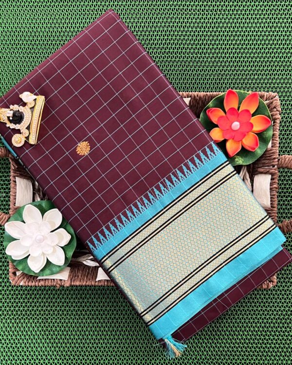 A luxurious Kanjivaram silk saree with intricate checks and butta designs in vibrant colors