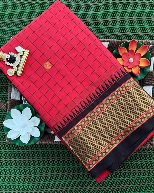 A luxurious Kanjivaram silk saree with intricate checks and butta designs in vibrant colors