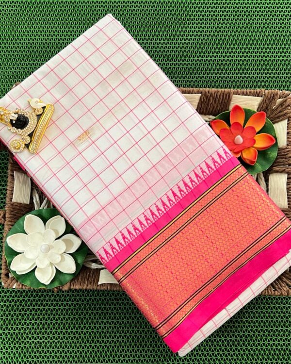 A luxurious Kanjivaram silk saree with intricate checks and butta designs in vibrant colors