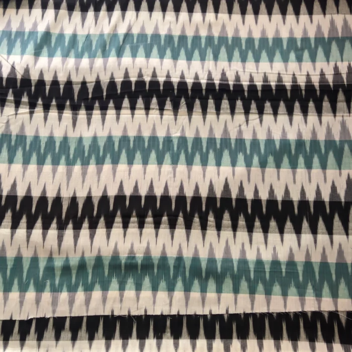 Pochampally ikat design cotton fabric in vibrant colors, handwoven by Pavankumarweaves. 45 inches wide, ideal for dresses, shirts, and home decor.