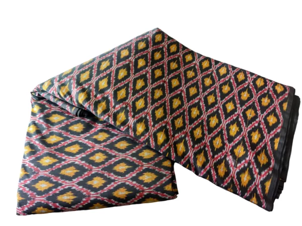 Vibrant cotton silk fabric with traditional patterns, showcasing detailed weaving and rich colors, ideal for traditional garments and home decor
