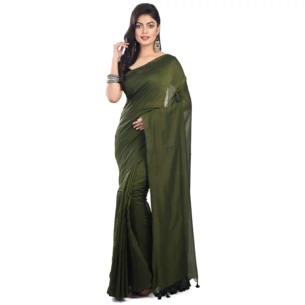 A woman gracefully draped in a vibrant green plain saree, exuding timeless elegance.