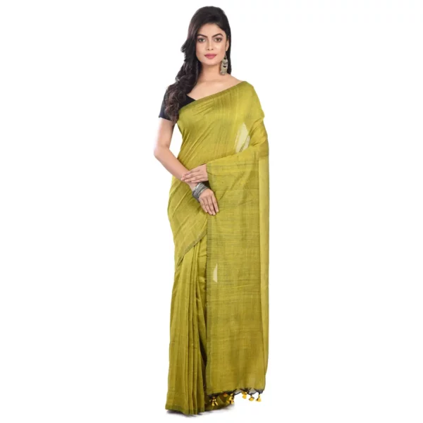 A woman gracefully draped in a vibrant green plain saree, exuding timeless elegance.