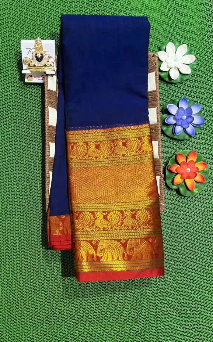 A rich blue Narayanpet sarees with a thick, golden border featuring elephant motifs.