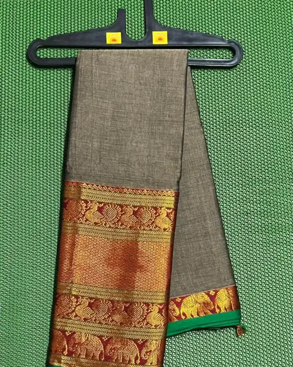 A grey Narayanpet sarees with a thick, golden and red border featuring elephant motifs.