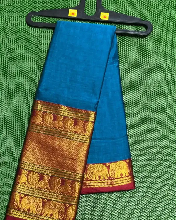 A turquoise blue Narayanpet sarees with a thick, golden border featuring elephant motifs.