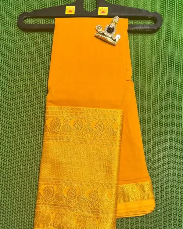 Vibrant yellow narayanpet sarees with a contrasting green border and intricate gold zari motifs.
