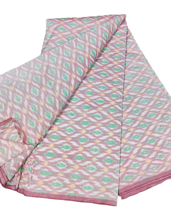 cotton silk fabric with a traditional ikat pattern featuring multicolored diamond motifs arranged in a symmetrical design."