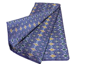 cotton silk fabric with a traditional ikat pattern featuring multicolored diamond motifs arranged in a symmetrical design."