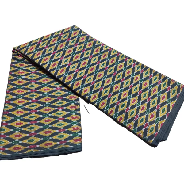 cotton silk fabric with a traditional ikat pattern featuring multicolored diamond motifs arranged in a symmetrical design."