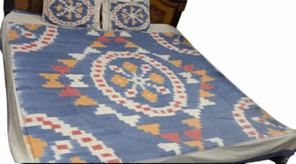 Elegant pure cotton handloom bedsheet, crafted for a king-size bed, featuring traditional weaves and vibrant colors