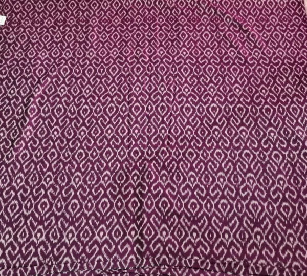 Soft ikat fabric showcasing intricate multicolor patterns, woven with precision to highlight the artistry of traditional craftsmanship