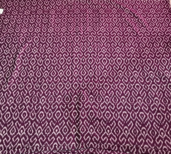 Soft ikat fabric showcasing intricate multicolor patterns, woven with precision to highlight the artistry of traditional craftsmanship