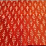 Richly textured ikat fabric in blue and green gradients, handwoven to perfection