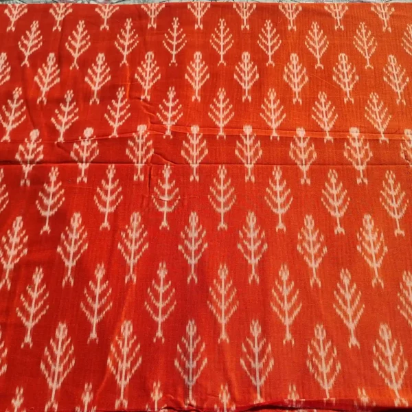 Richly textured ikat fabric in blue and green gradients, handwoven to perfection