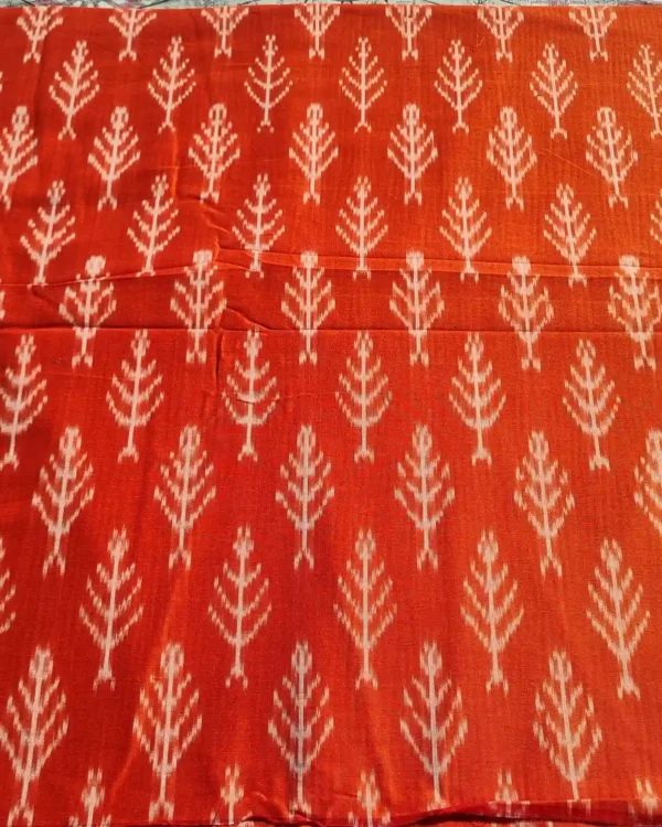 Richly textured ikat fabric in blue and green gradients, handwoven to perfection