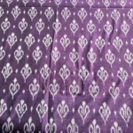 Traditional ikat fabric in red and black checks, a timeless choice for sarees and shirts
