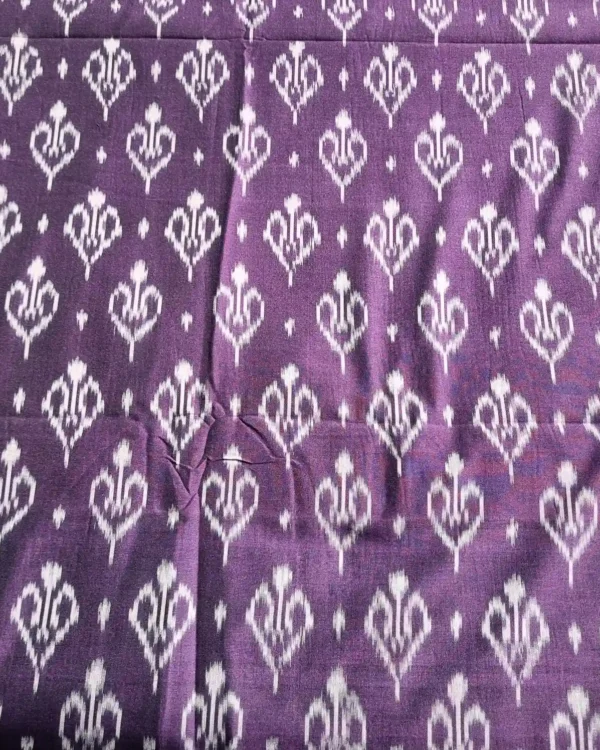Traditional ikat fabric in red and black checks, a timeless choice for sarees and shirts