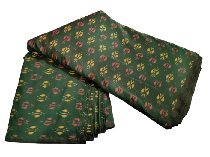 Colorful ikat fabric with symmetrical diamond motifs, crafted from a premium cotton-silk blend, perfect for dresses and upholstery