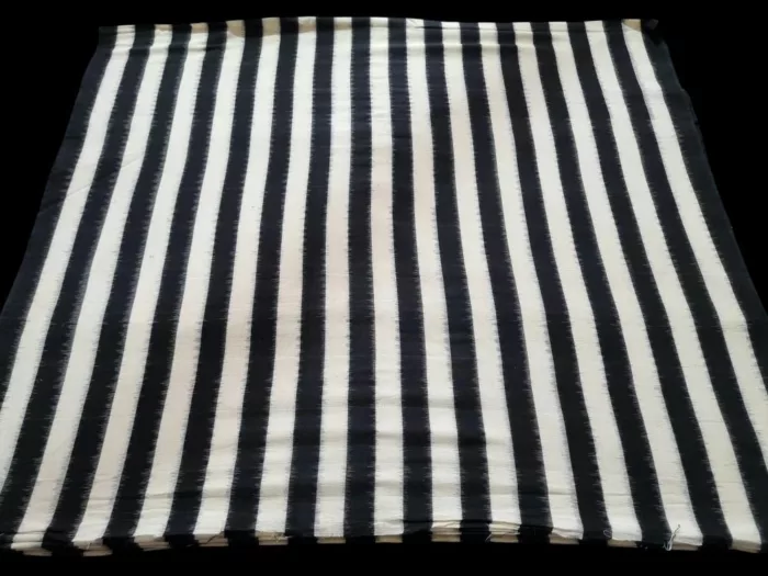 Close-up of premium double ikat fabric, hand-dyed and woven with precision