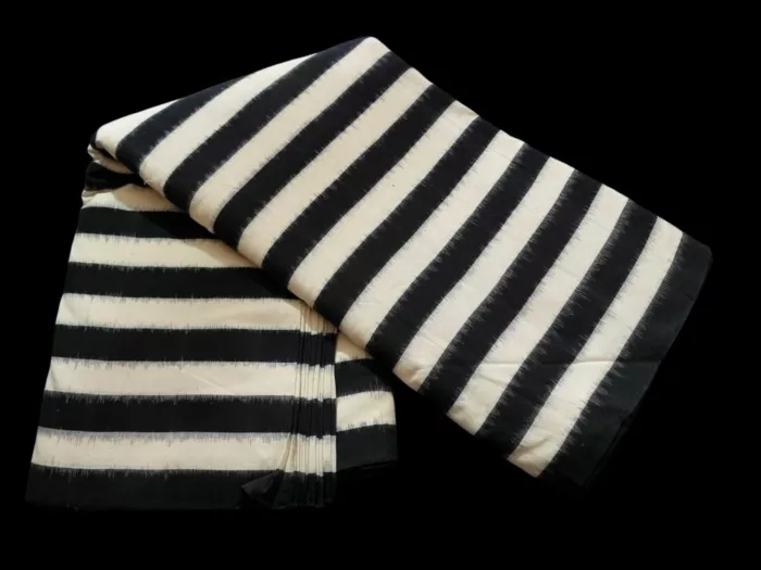 Traditional double ikat fabric showcasing intricate craftsmanship and colorful designs