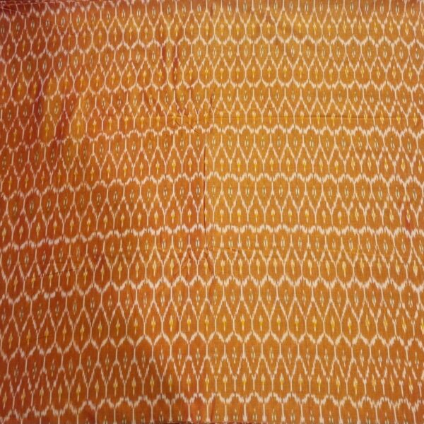 Traditional ikat fabric displayed with vibrant pink and purple tones
