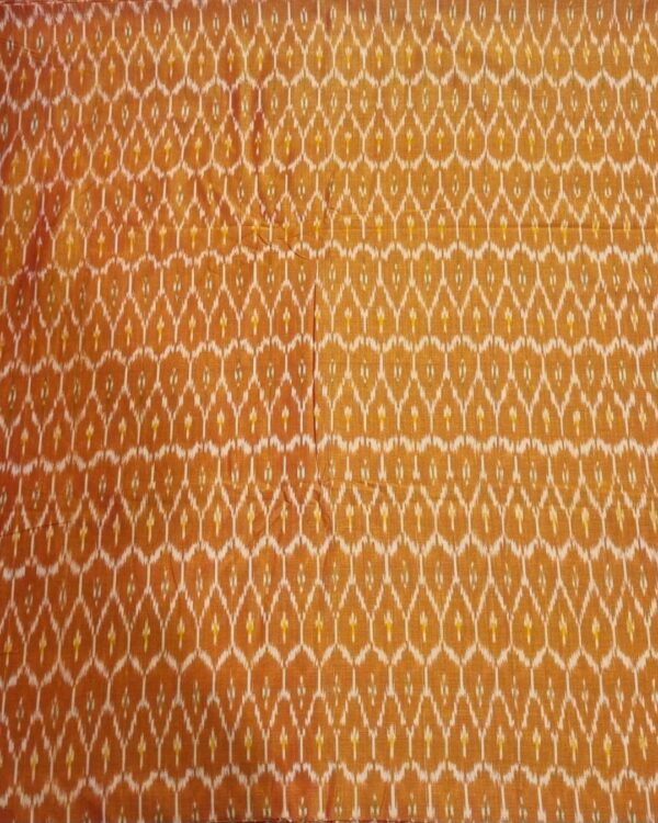 Traditional ikat fabric displayed with vibrant pink and purple tones