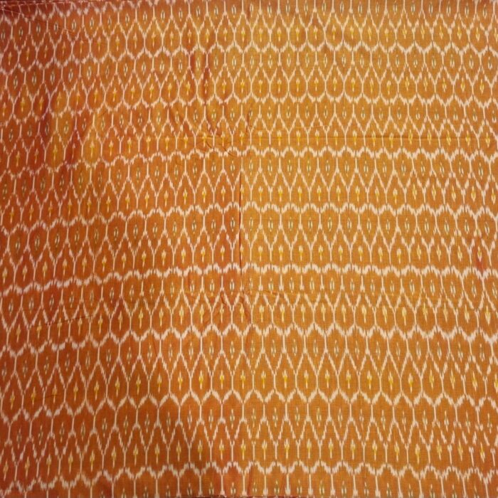Traditional ikat fabric displayed with vibrant pink and purple tones