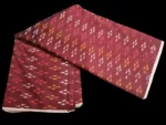Ethnic ikat fabric draped to highlight its rich texture and colors