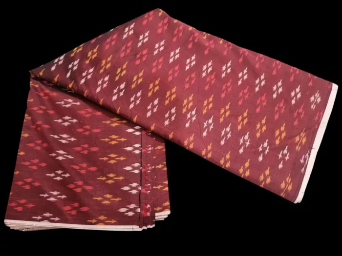 Ethnic ikat fabric draped to highlight its rich texture and colors