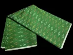 Pure cotton ikat fabric with intricate handwoven design, ideal for dresses and kurtas