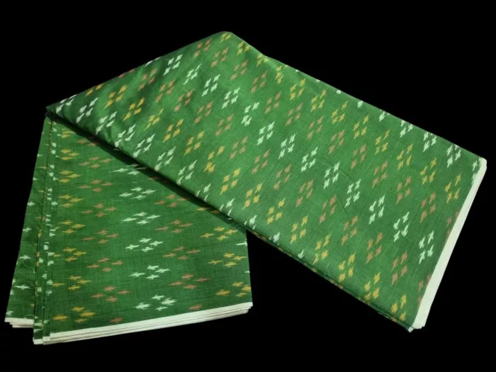 Pure cotton ikat fabric with intricate handwoven design, ideal for dresses and kurtas