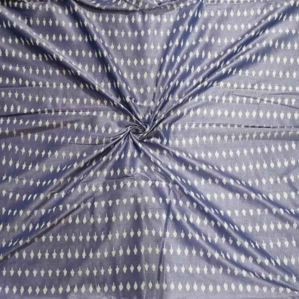 Close shot of natural dyed ikat fabric with symmetrical motifs