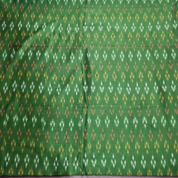 Pure cotton ikat fabric with intricate handwoven design, ideal for dresses and kurtas
