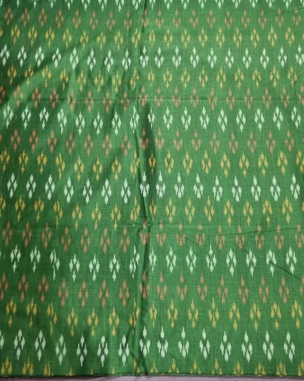 Pure cotton ikat fabric with intricate handwoven design, ideal for dresses and kurtas