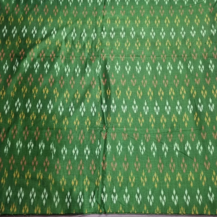 Pure cotton ikat fabric with intricate handwoven design, ideal for dresses and kurtas
