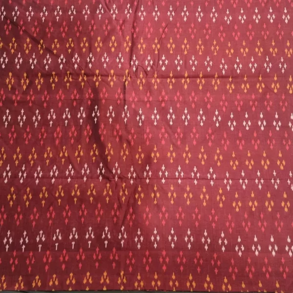 Ethnic ikat fabric draped to highlight its rich texture and colors