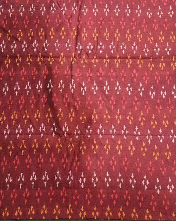 Ethnic ikat fabric draped to highlight its rich texture and colors
