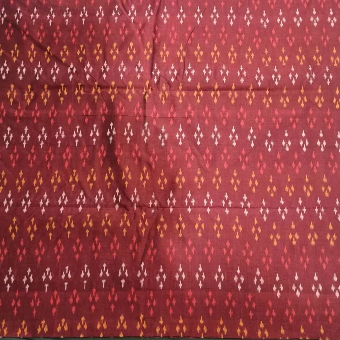 Ethnic ikat fabric draped to highlight its rich texture and colors