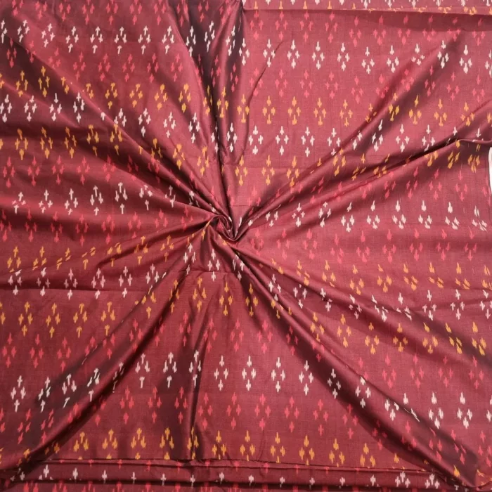 Ethnic ikat fabric draped to highlight its rich texture and colors
