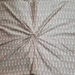 Detailed view of ikat textile with bold zigzag pattern in blue and white