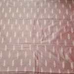 Close-up of vibrant ikat fabric with intricate geometric patterns