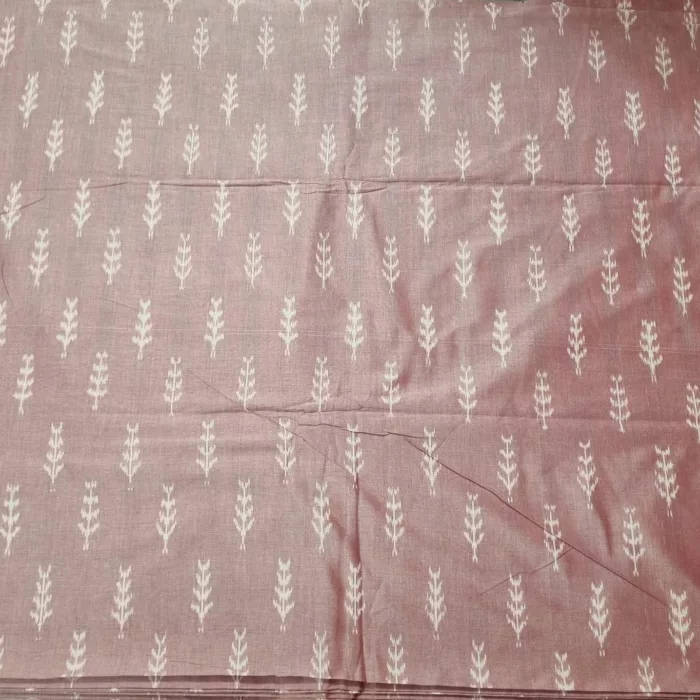 Close-up of vibrant ikat fabric with intricate geometric patterns