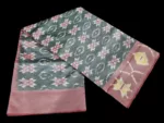 Photo of a handwoven semi-silk Pochampally saree featuring vibrant ikat diamond and temple motifs, showing the broad patterned border and pallu alongside a matching blouse piece.
