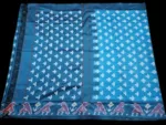 Close-up of a handwoven semi-silk Pochampally saree showing vibrant ikat diamond and temple motifs on a broad border