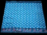 Close-up of a handwoven semi-silk Pochampally saree showing vibrant ikat diamond and temple motifs on a broad border