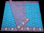 Close-up of a handwoven semi-silk Pochampally saree showing vibrant ikat diamond and temple motifs on a broad border