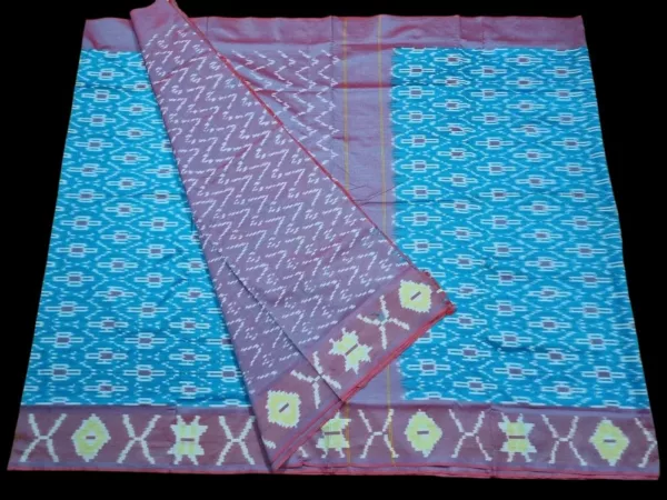Close-up of a handwoven semi-silk Pochampally saree showing vibrant ikat diamond and temple motifs on a broad border