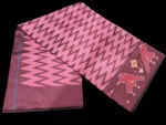 Close-up of a handwoven semi-silk Pochampally saree showing vibrant ikat diamond and temple motifs on a broad border